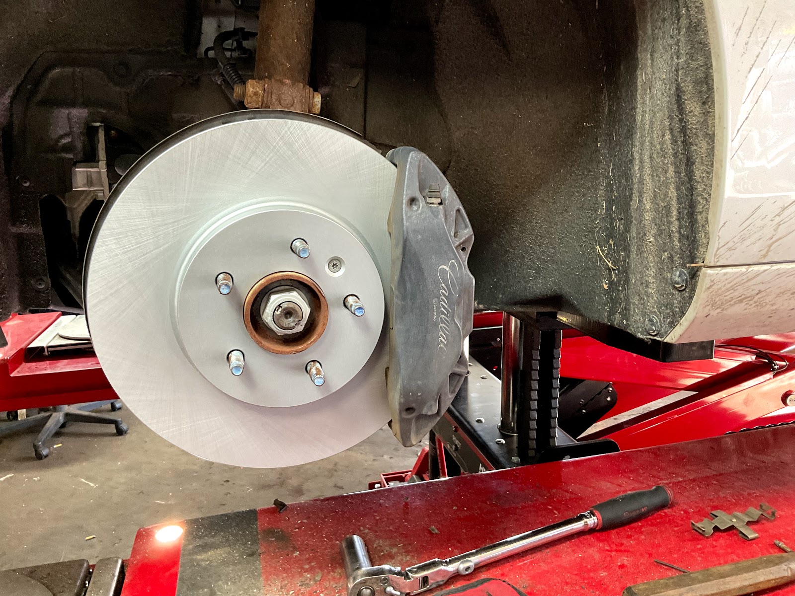 Front brake rotor being serviced on a vehicle at Bhalli Auto